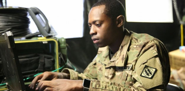 Soldier using a computer. 